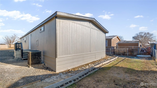 view of side of property with central AC unit