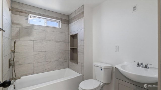 full bathroom with vanity, tiled shower / bath combo, and toilet