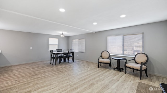 dining area with light hardwood / wood-style flooring and a wealth of natural light