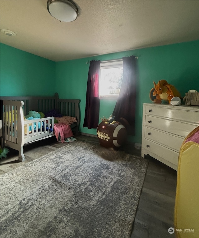 bedroom with wood finished floors