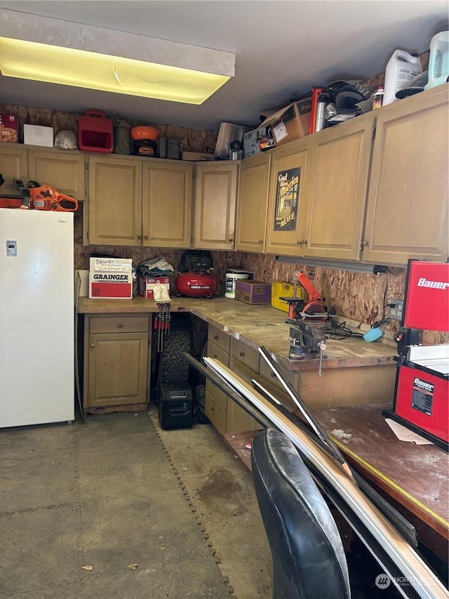 kitchen featuring freestanding refrigerator