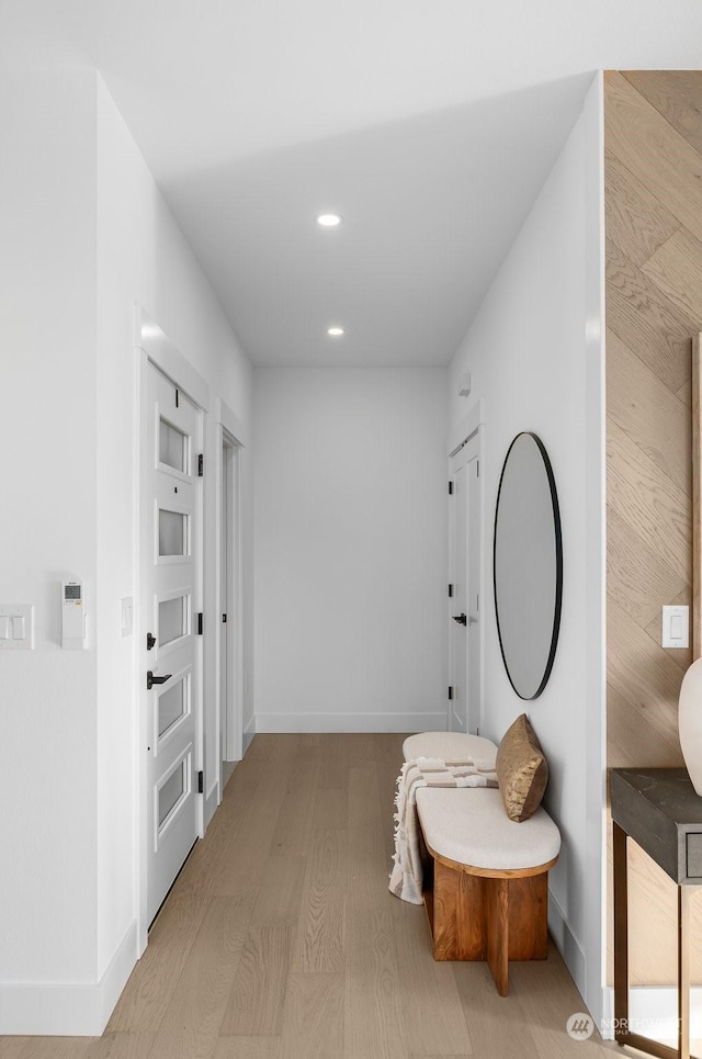 hallway with light wood-type flooring