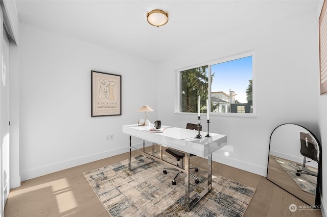 home office with light wood-type flooring