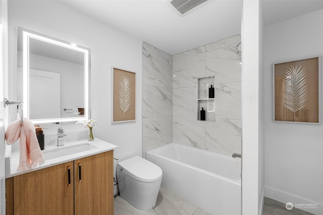 full bathroom featuring vanity, toilet, and tiled shower / bath combo