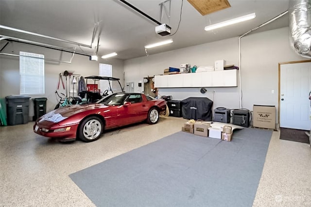 garage featuring a garage door opener