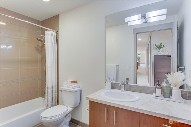 full bathroom featuring vanity, shower / bath combination with curtain, and toilet