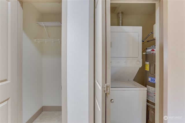 laundry area with stacked washer / drying machine