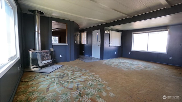 interior space featuring a wood stove