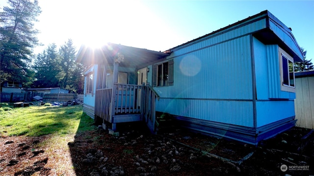 view of home's exterior featuring a yard