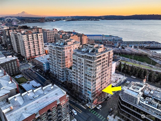 aerial view at dusk with a water view