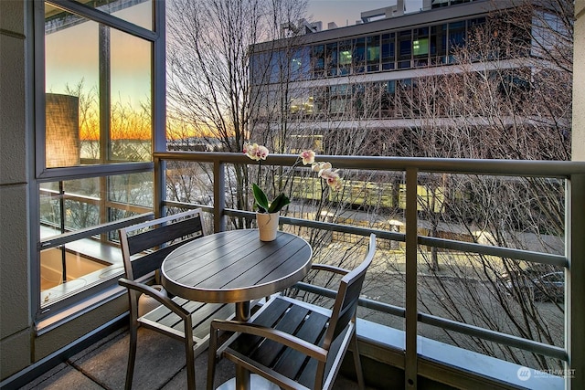 view of balcony at dusk