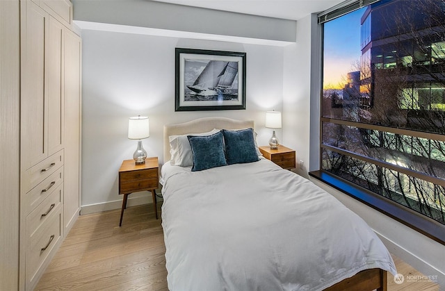 bedroom featuring light wood-type flooring