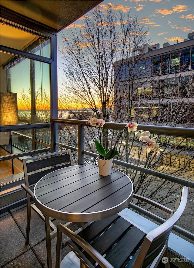 view of balcony at dusk