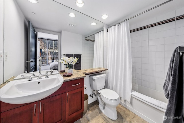 full bathroom featuring vanity, toilet, and shower / bathtub combination with curtain