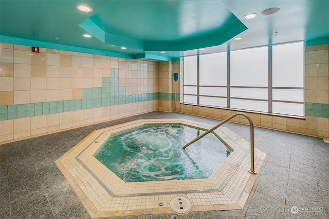 view of pool featuring an indoor hot tub