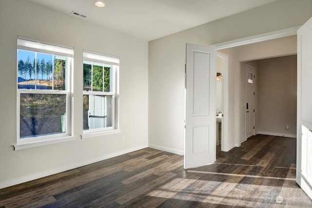 empty room featuring dark hardwood / wood-style floors