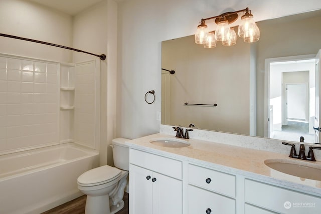 full bathroom with vanity, shower / tub combination, and toilet