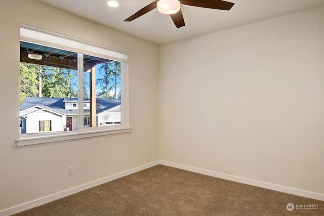 carpeted empty room with ceiling fan