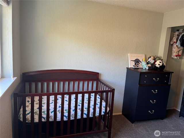 carpeted bedroom with a textured wall