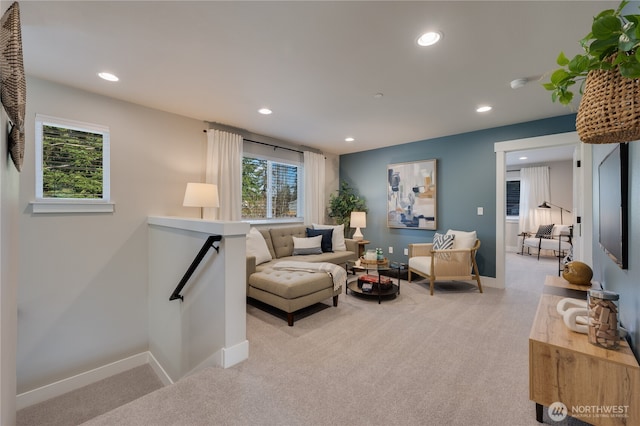 living room with light carpet, recessed lighting, and baseboards