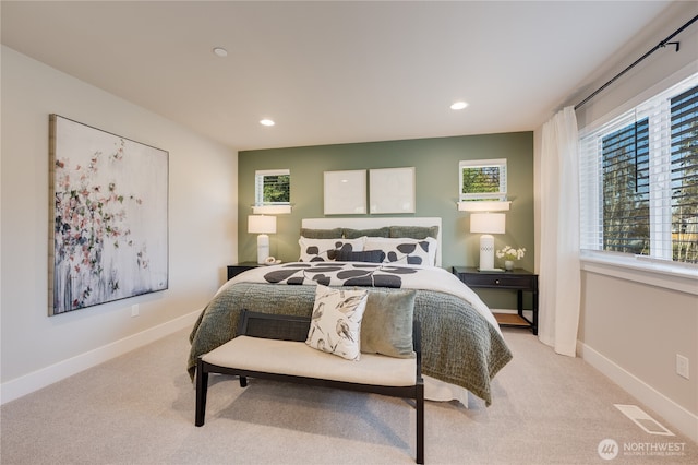 bedroom featuring light colored carpet, visible vents, recessed lighting, and baseboards