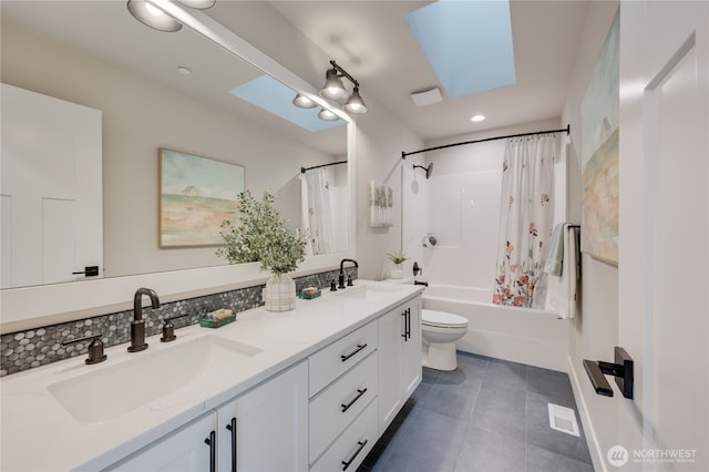 full bath featuring tile patterned flooring, double vanity, shower / tub combo with curtain, and a sink