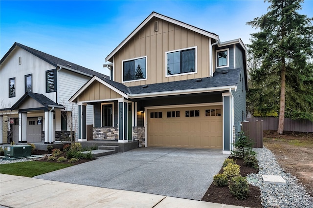 view of front of property featuring a porch, a garage, board and batten siding, and driveway