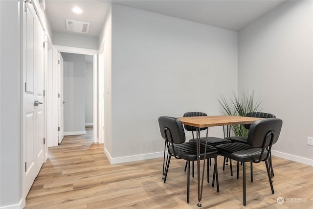 dining space featuring light hardwood / wood-style floors