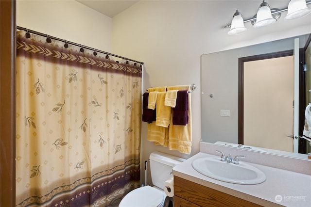 bathroom with vanity and toilet