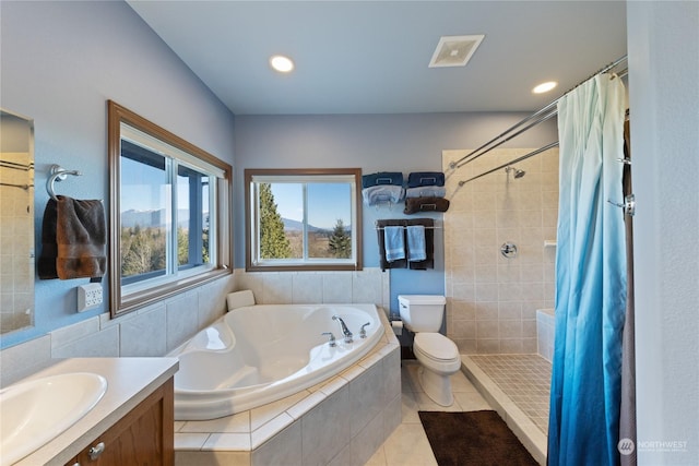 full bathroom featuring tile patterned flooring, vanity, separate shower and tub, and toilet