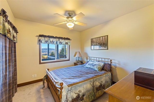 bedroom with light colored carpet and ceiling fan