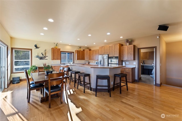 dining space featuring light wood-type flooring