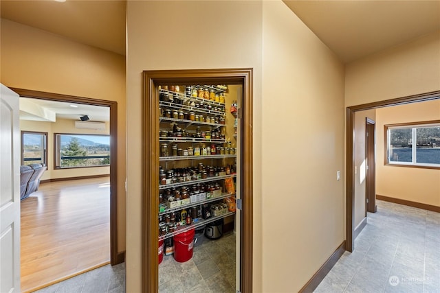 wine area featuring a wall unit AC