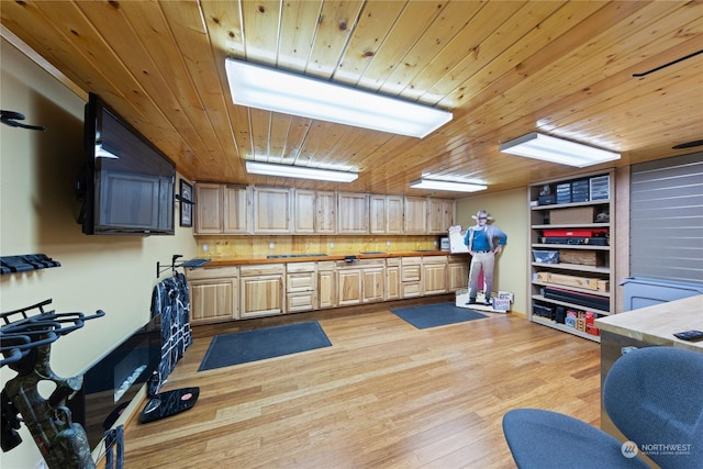 exercise area with wood ceiling and light hardwood / wood-style floors