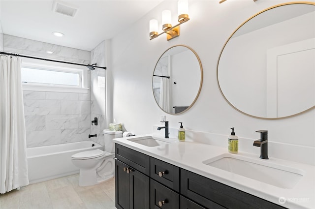 full bathroom with vanity, toilet, and shower / bath combo