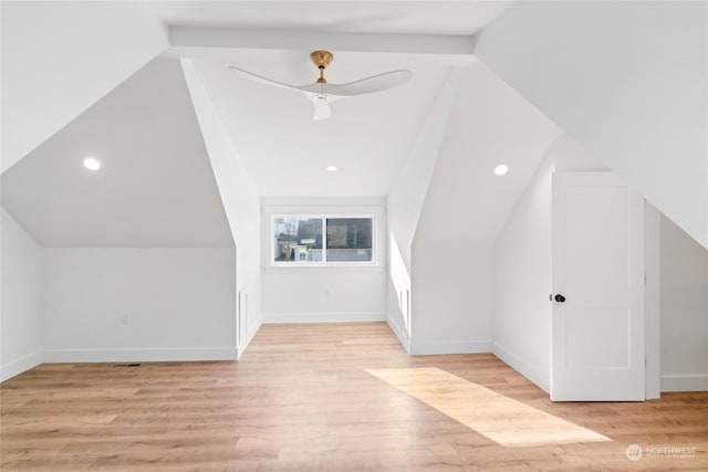 additional living space featuring lofted ceiling and light hardwood / wood-style flooring