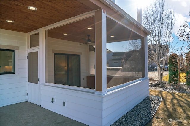 exterior space with ceiling fan and a sunroom