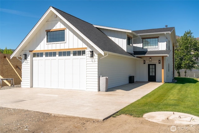 33 Hard Cider Dr, Oroville, WA 98844 - modern inspired farmhouse featuring board and batten siding, driveway, roof with shingles, and a front yard