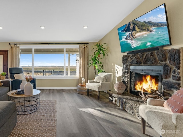 sitting room with a fireplace and hardwood / wood-style floors