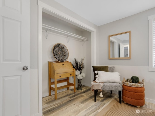 sitting room featuring light hardwood / wood-style floors