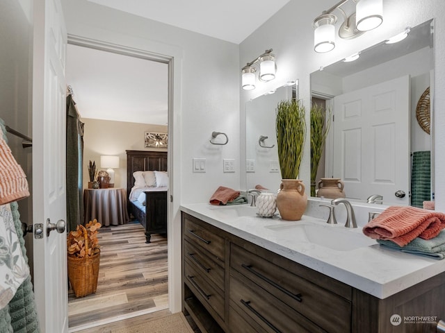 bathroom with vanity and hardwood / wood-style floors