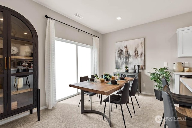 view of carpeted dining area