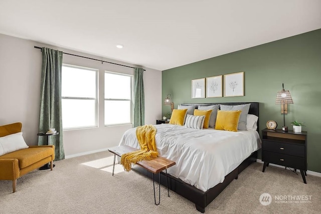 bedroom featuring light colored carpet