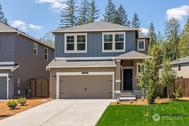 front facade with a garage and a front lawn