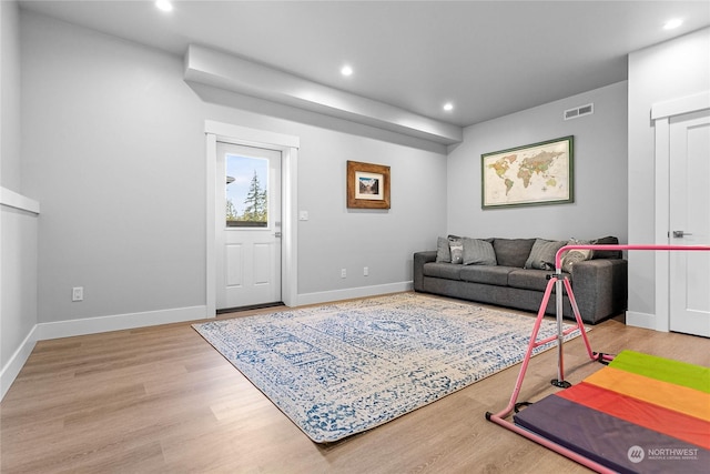 living room with light hardwood / wood-style flooring