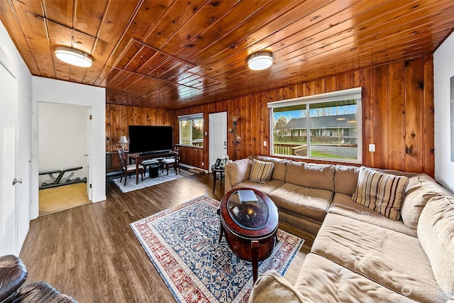 living room with dark hardwood / wood-style floors, wooden walls, and wood ceiling