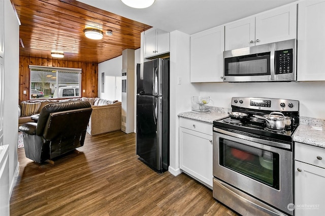 kitchen featuring appliances with stainless steel finishes, wooden ceiling, white cabinets, and dark hardwood / wood-style floors