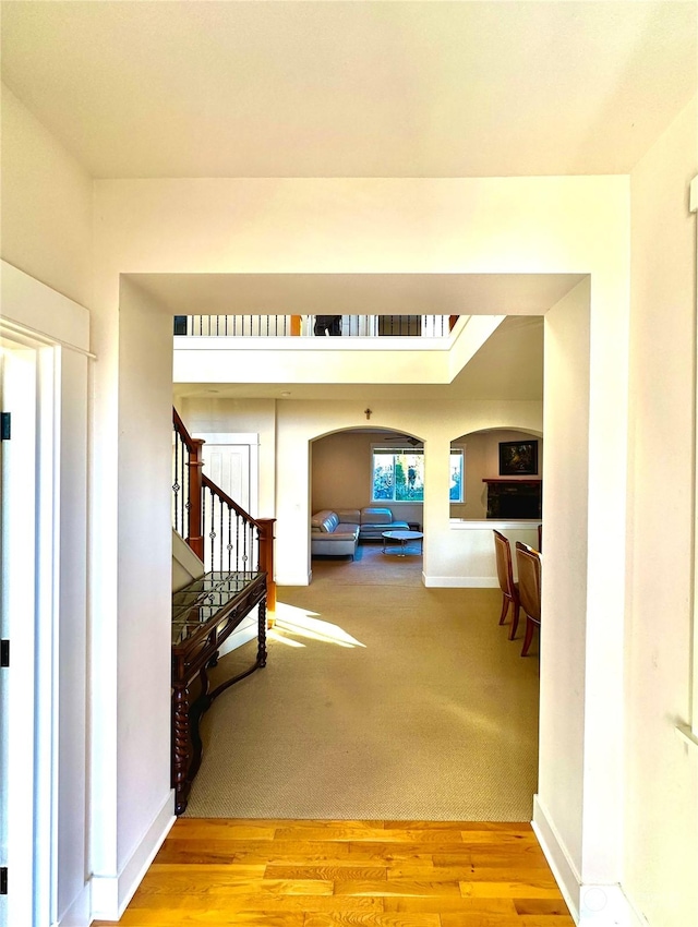 hall with light hardwood / wood-style flooring