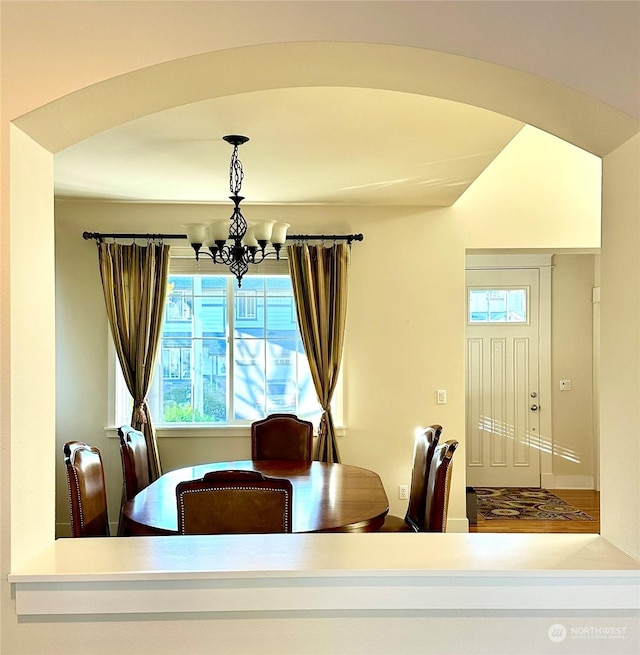 dining area featuring a notable chandelier and a wealth of natural light