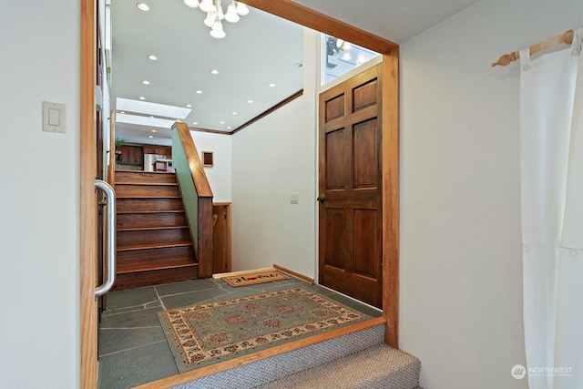 stairway featuring tile patterned flooring and crown molding